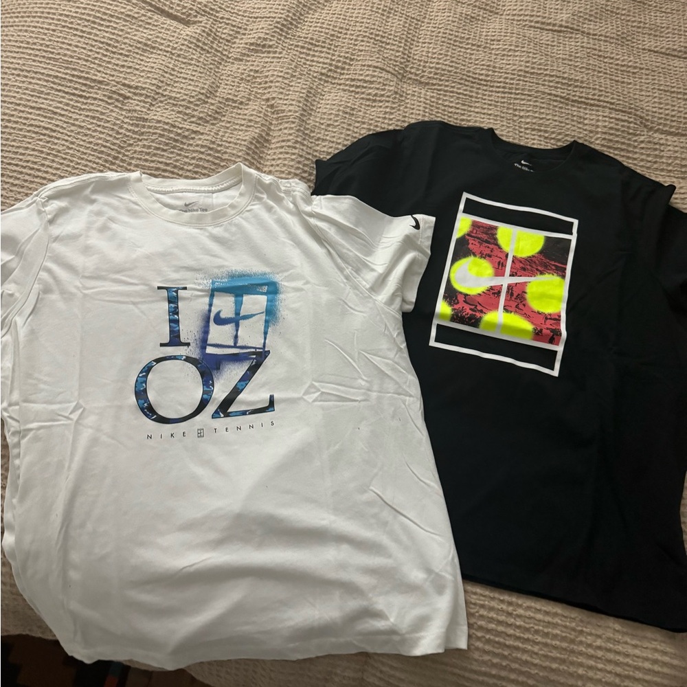 2 Nike t shirts . Warn once